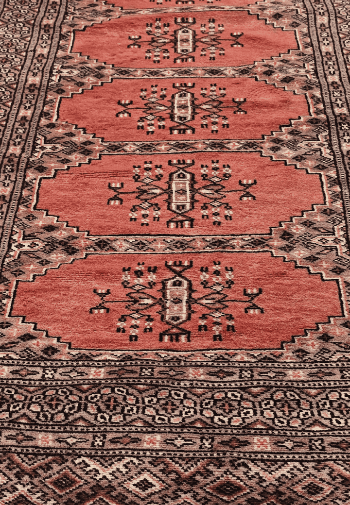 Hand-knotted salmon Bokhara runner with ivory Turkmen güls