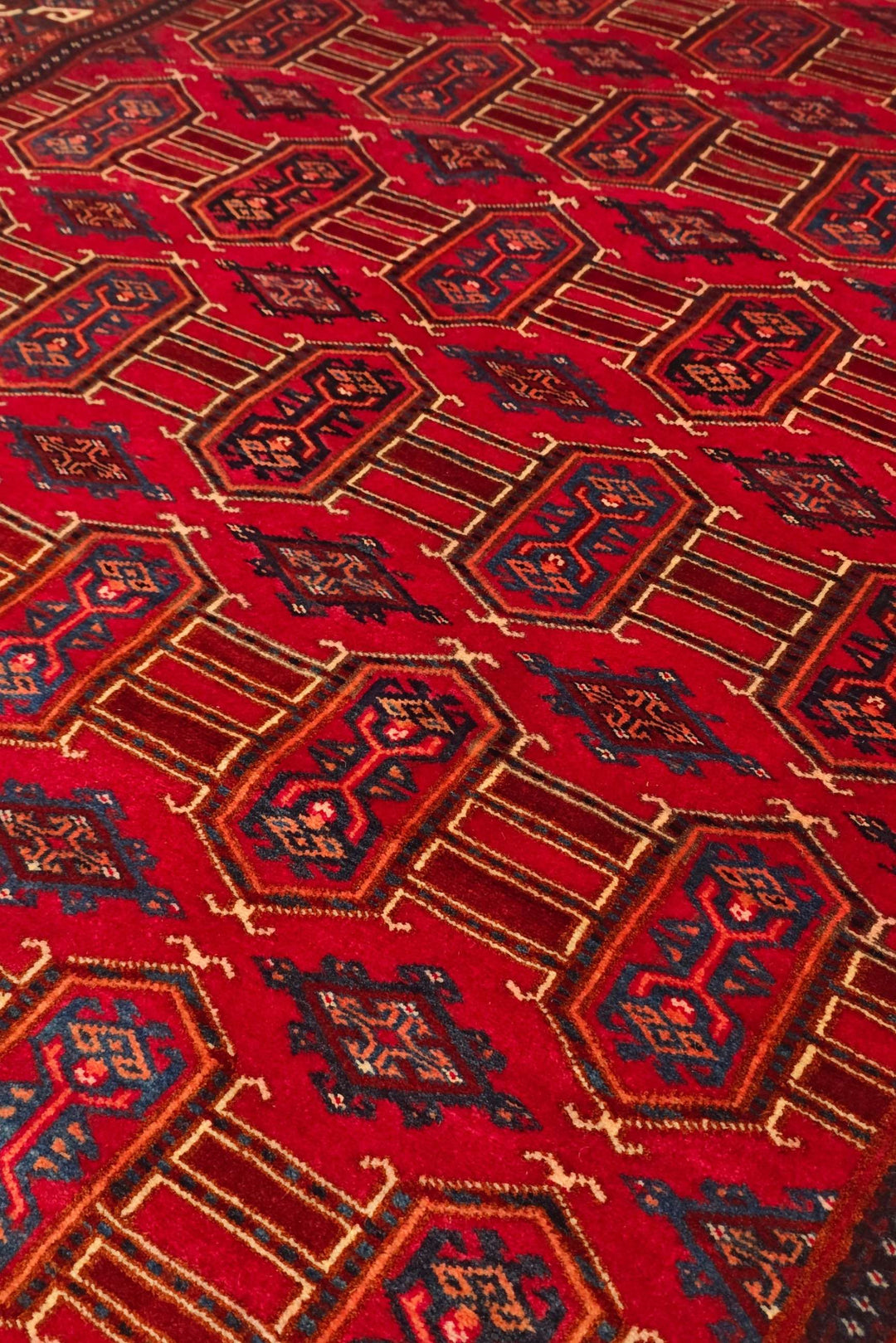 Turkmen panel design in deep red on Afghan Sherwan rug