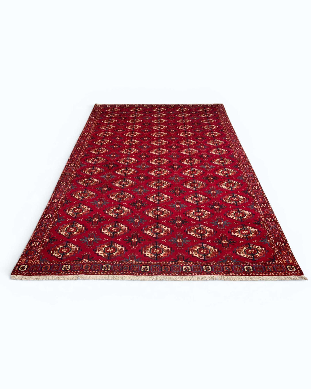Border detail of red Turkmen Bokhara hand-knotted Afghan rug