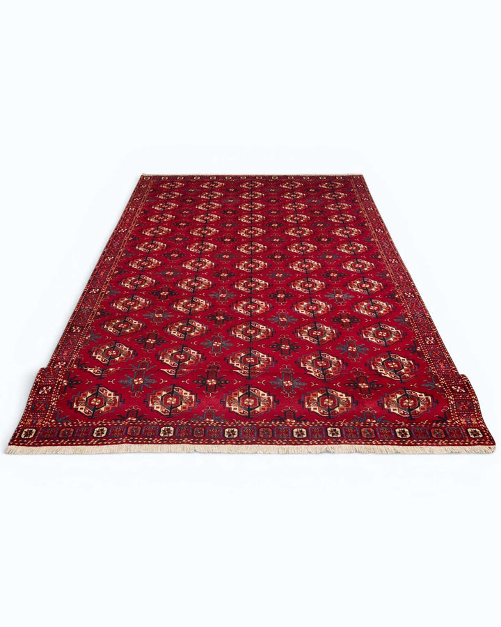 One-of-a-kind red Turkmen Bokhara Afghan Sherwan rug
