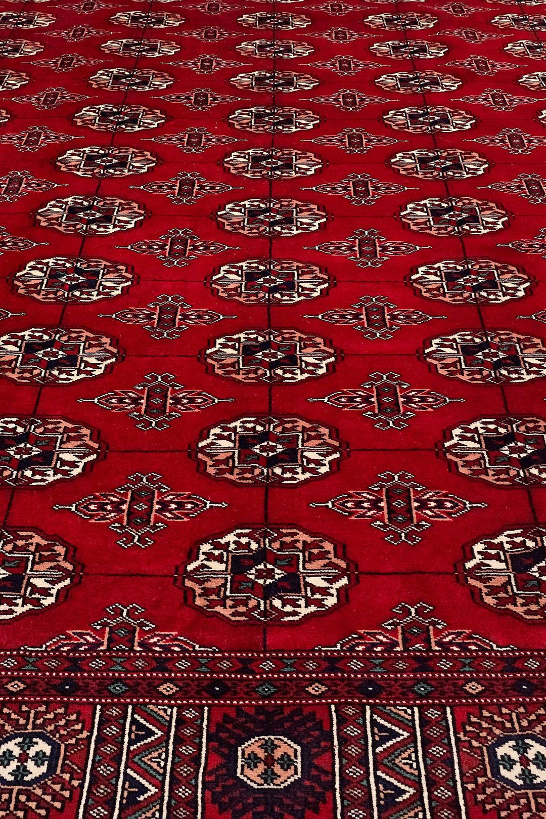 Border detail of red hand-knotted Bokhara rug, 219×291cm
