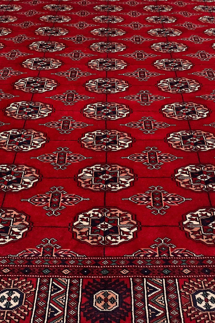 Border detail of red hand-knotted Bokhara rug, 219×291cm