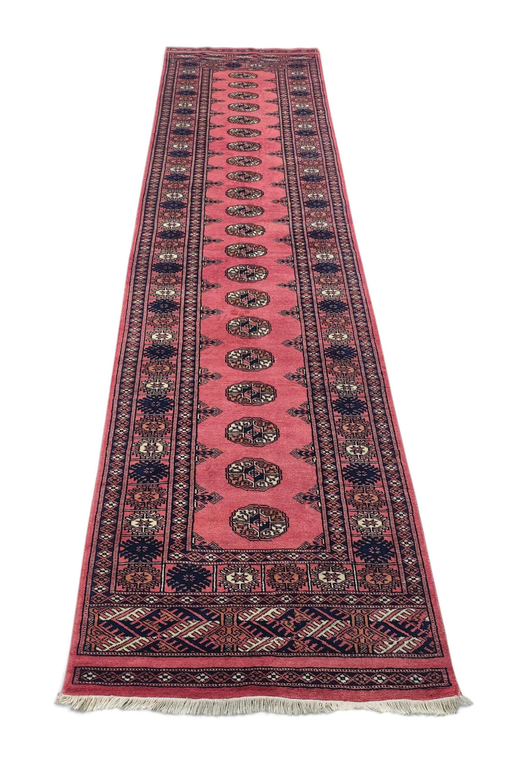 Border detail of rose and navy hand-knotted Bokhara runner
