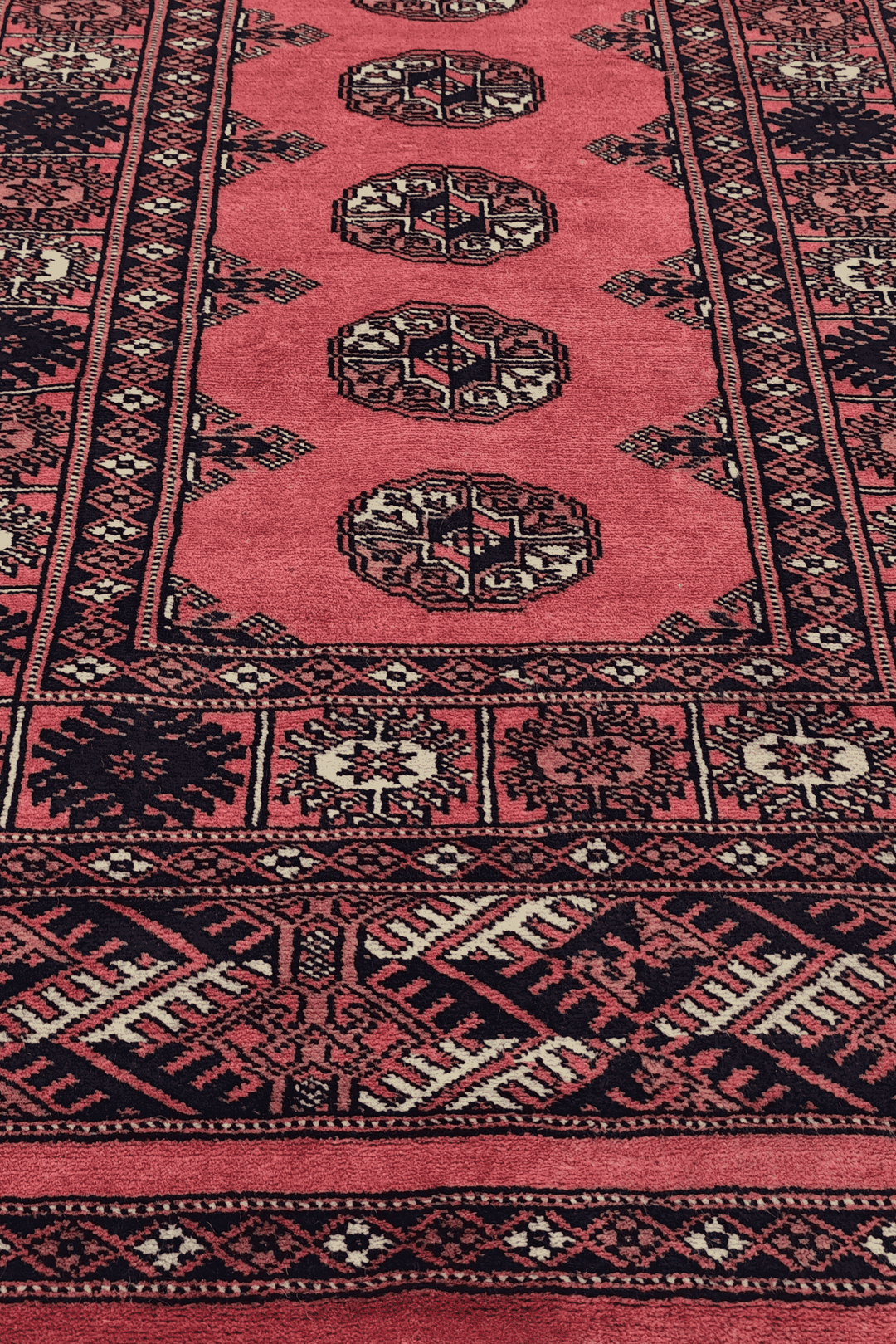 Hand-knotted rose Bokhara runner with navy Turkmen güls