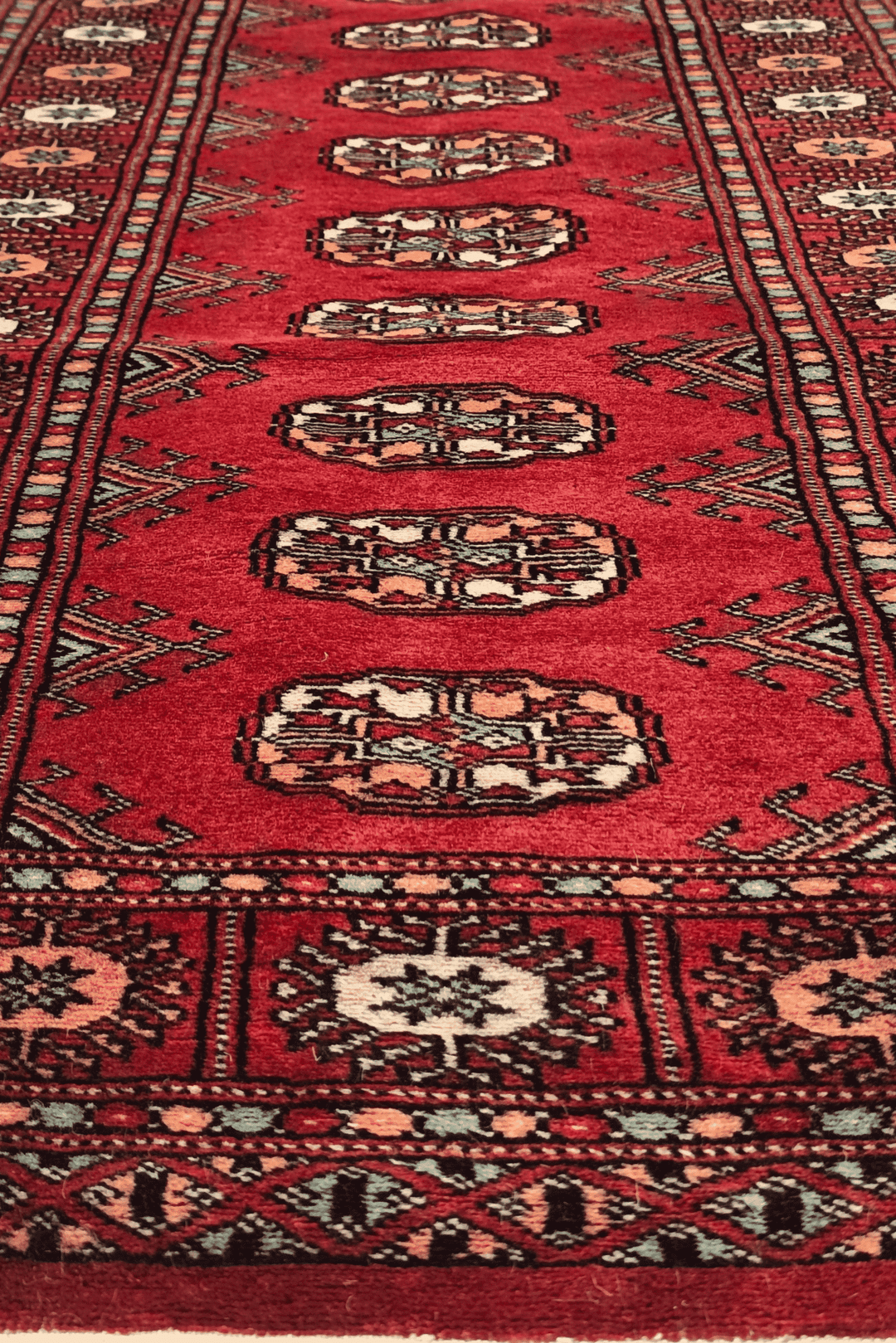 One-of-a-kind ruby red and peach Pakistani Bokhara entrance mat