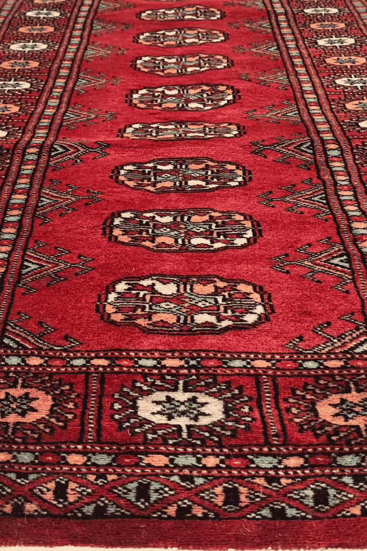 One-of-a-kind ruby red and peach Pakistani Bokhara entrance mat