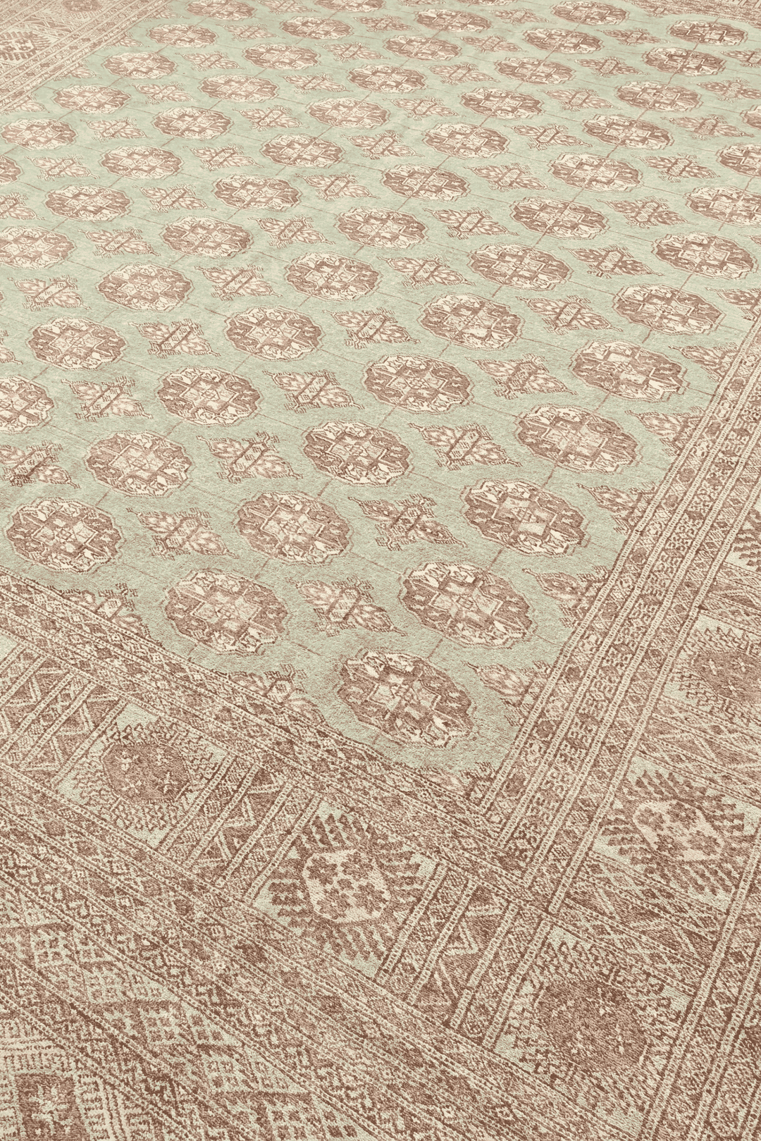 Turkmen gül motifs in sage and rose on Pakistani Bokhara rug