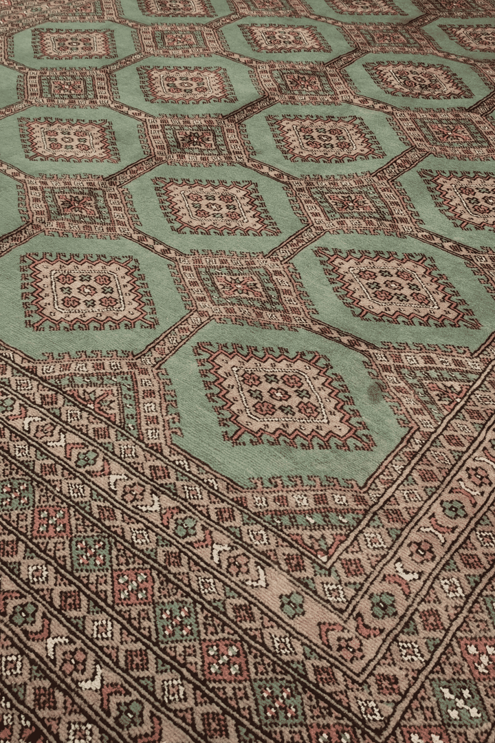 Compartment lattice detail in sage green and taupe on Bokhara rug