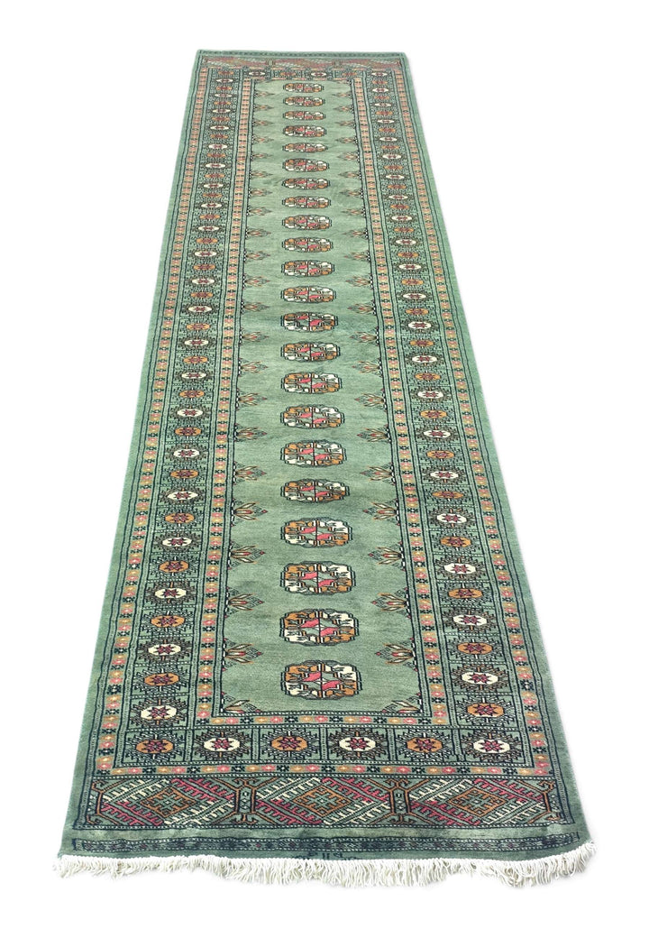 Border detail of sage and gold hand-knotted Bokhara runner