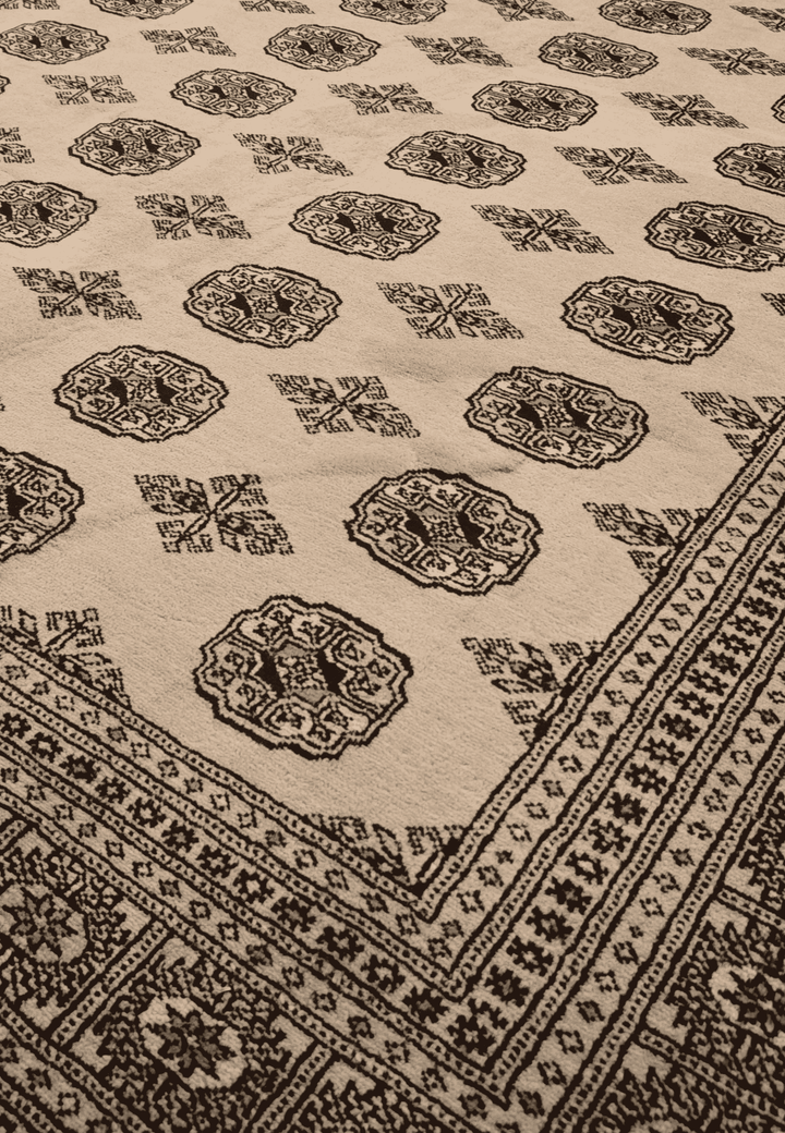 Turkmen gül motifs in sandy beige and black on Bokhara rug