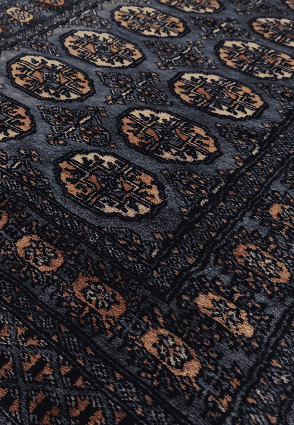 Turkmen gül motifs in slate blue and cream on Bokhara runner