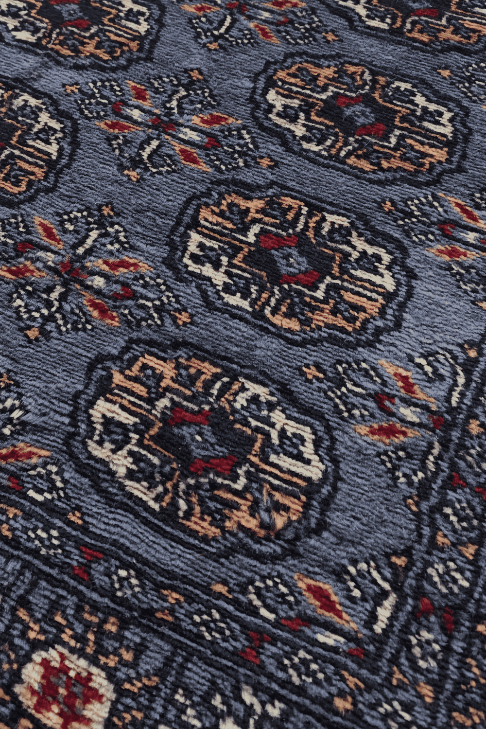 Turkmen gül motifs in slate blue and camel on long Bokhara runner