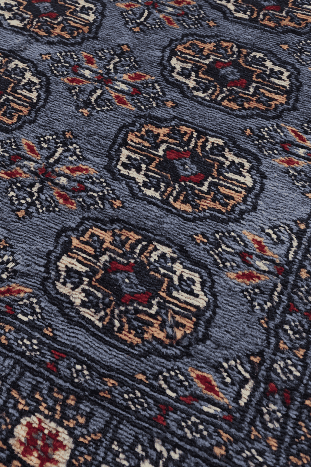 Turkmen gül motifs in slate blue and camel on long Bokhara runner