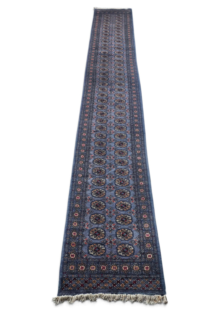 Border detail of slate blue and camel hand-knotted Bokhara runner