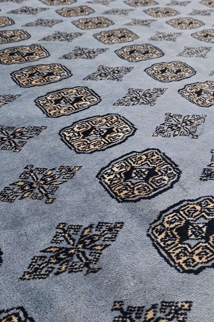 Border detail of slate grey hand-knotted Bokhara rug
