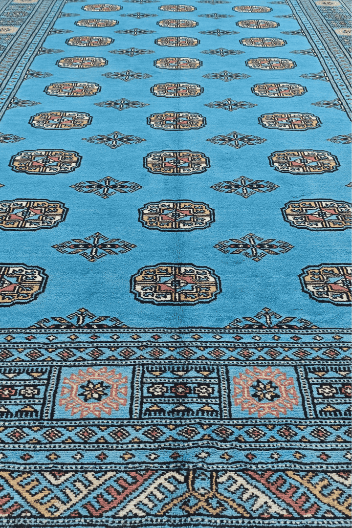 One-of-a-kind turquoise and ivory Pakistani Bokhara rug, 155×250cm