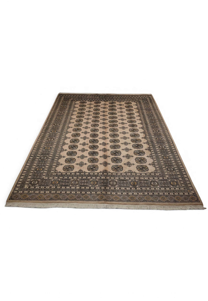 Border detail of warm sand and charcoal hand-knotted Bokhara rug