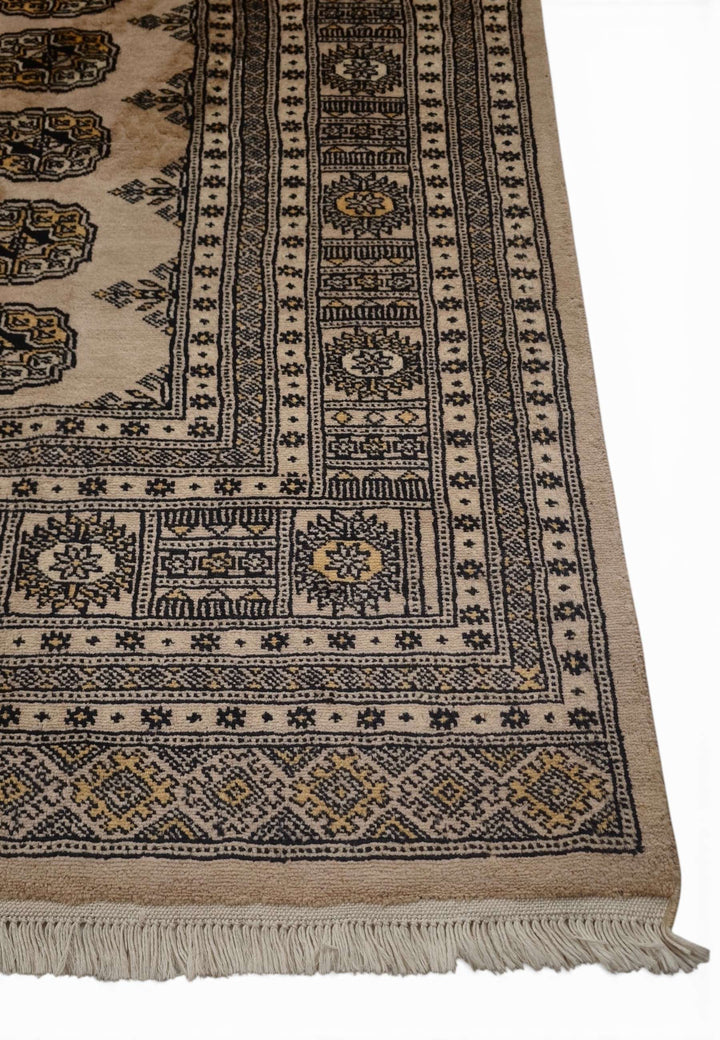 One-of-a-kind warm sand and charcoal Pakistani Bokhara rug
