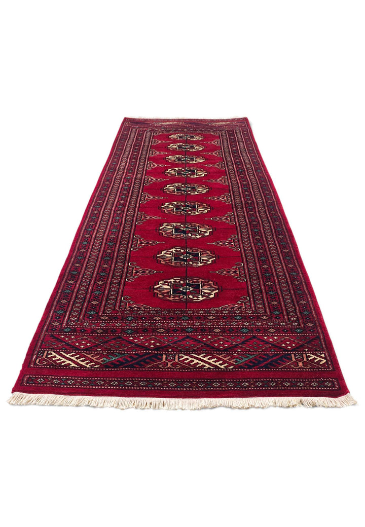 Border detail of wine red and cream hand-knotted Bokhara rug