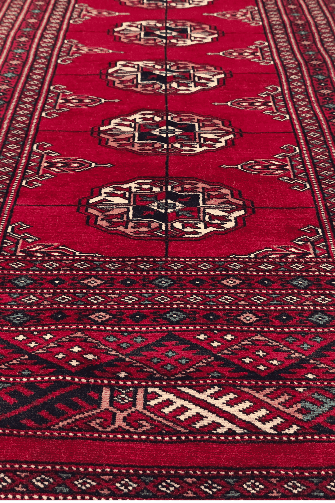 One-of-a-kind wine red and cream Pakistani Bokhara accent rug