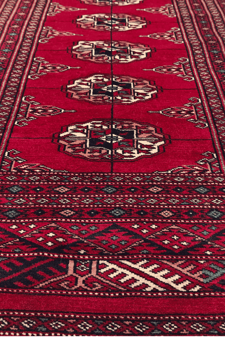 One-of-a-kind wine red and cream Pakistani Bokhara accent rug