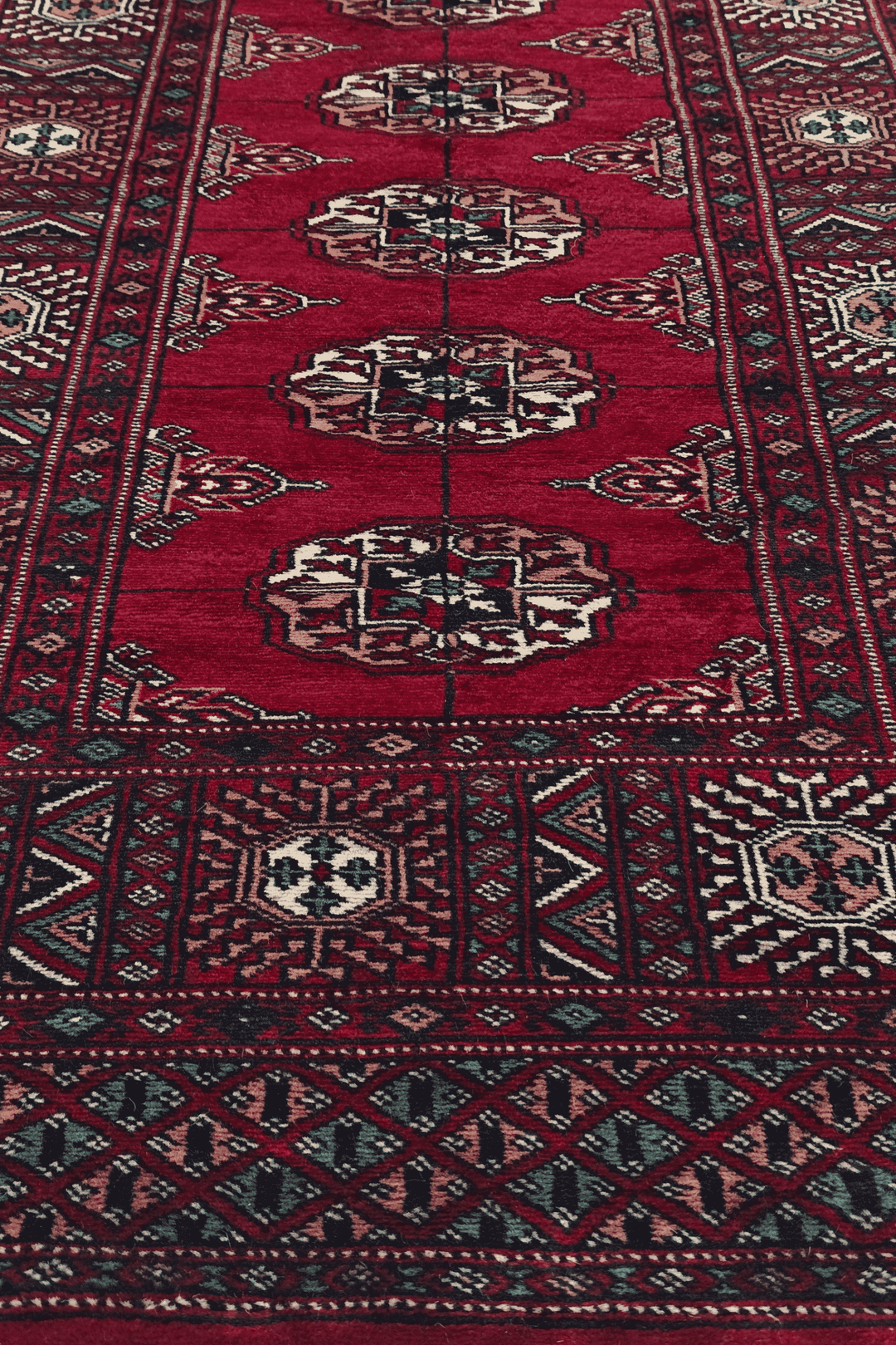Hand-knotted wine red Bokhara runner with cream Turkmen güls