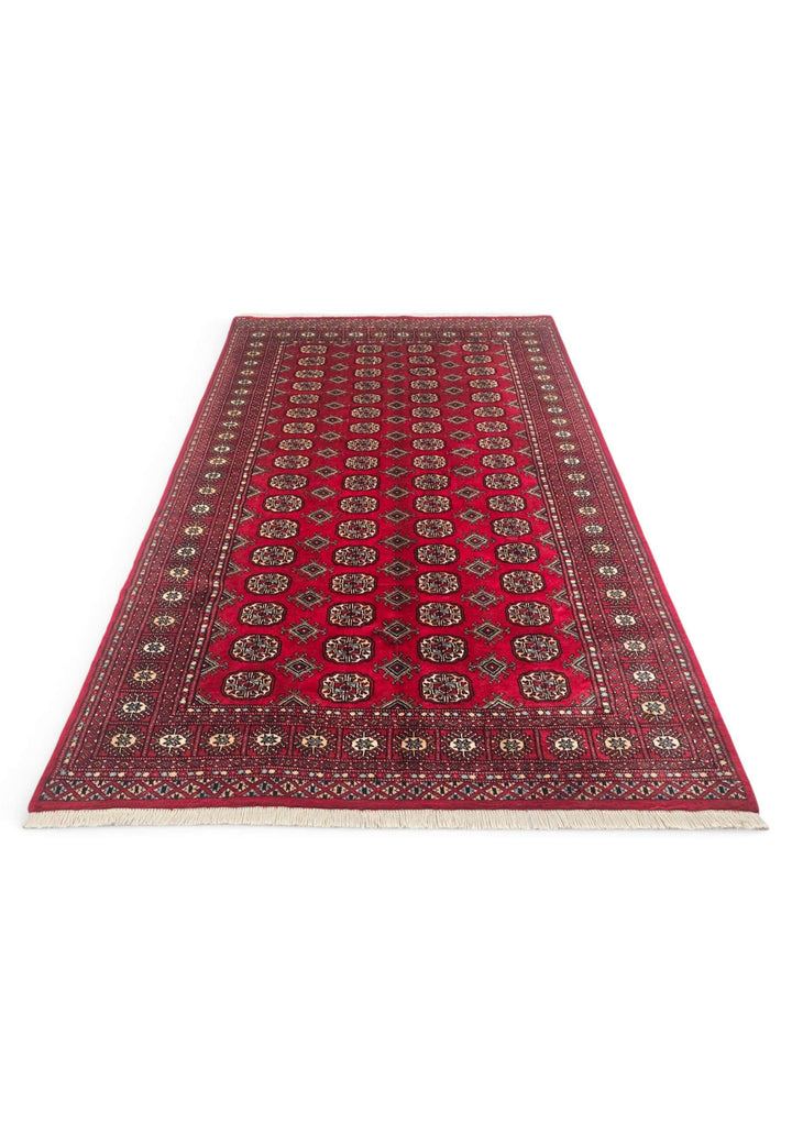 Border detail of wine red hand-knotted Bokhara wool rug