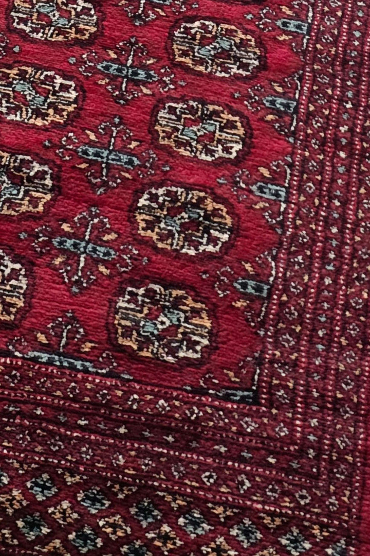 Turkmen gül motifs on wine red Bokhara corridor runner