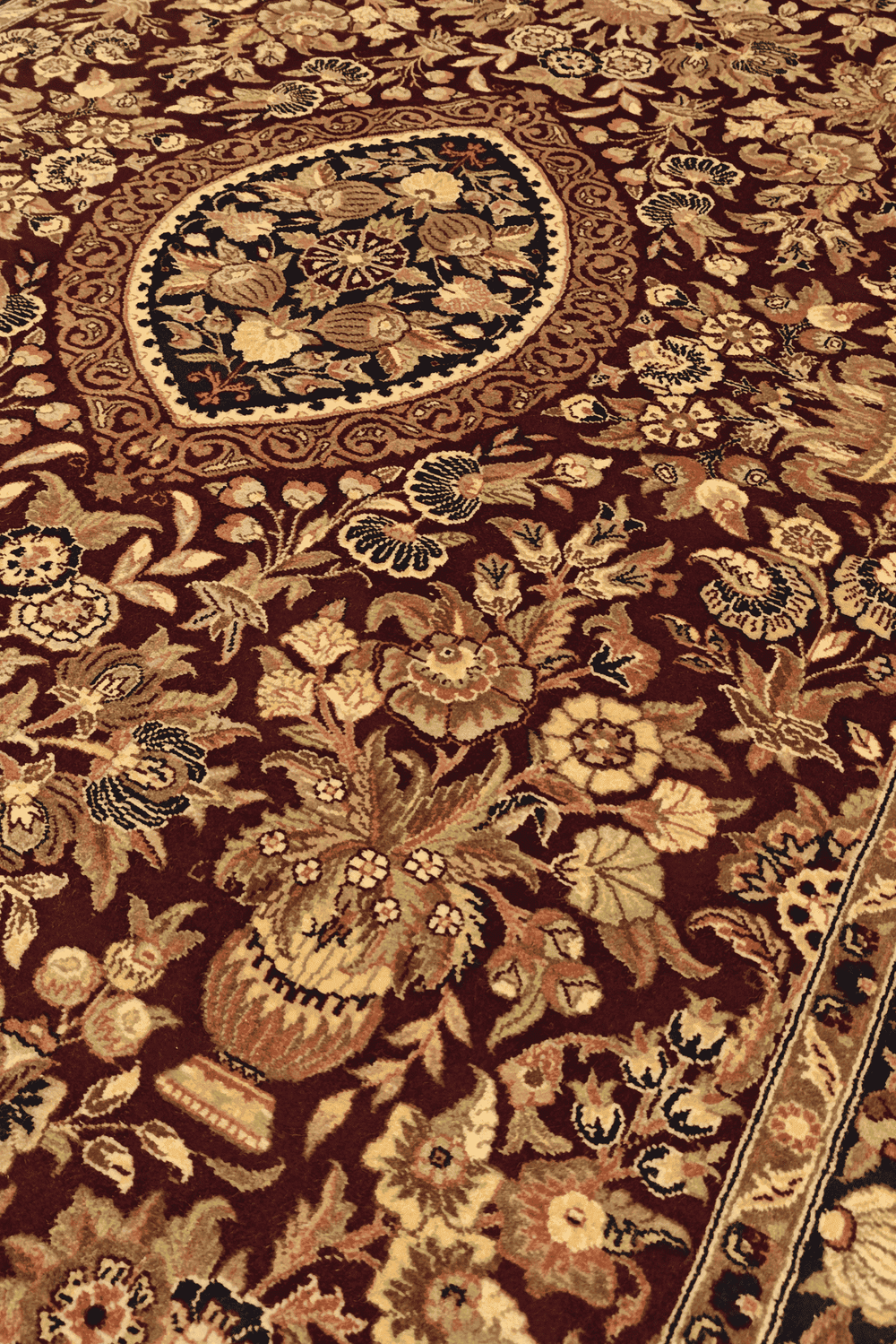 Vase garden detail in deep red on Tabriz Pakistani rug