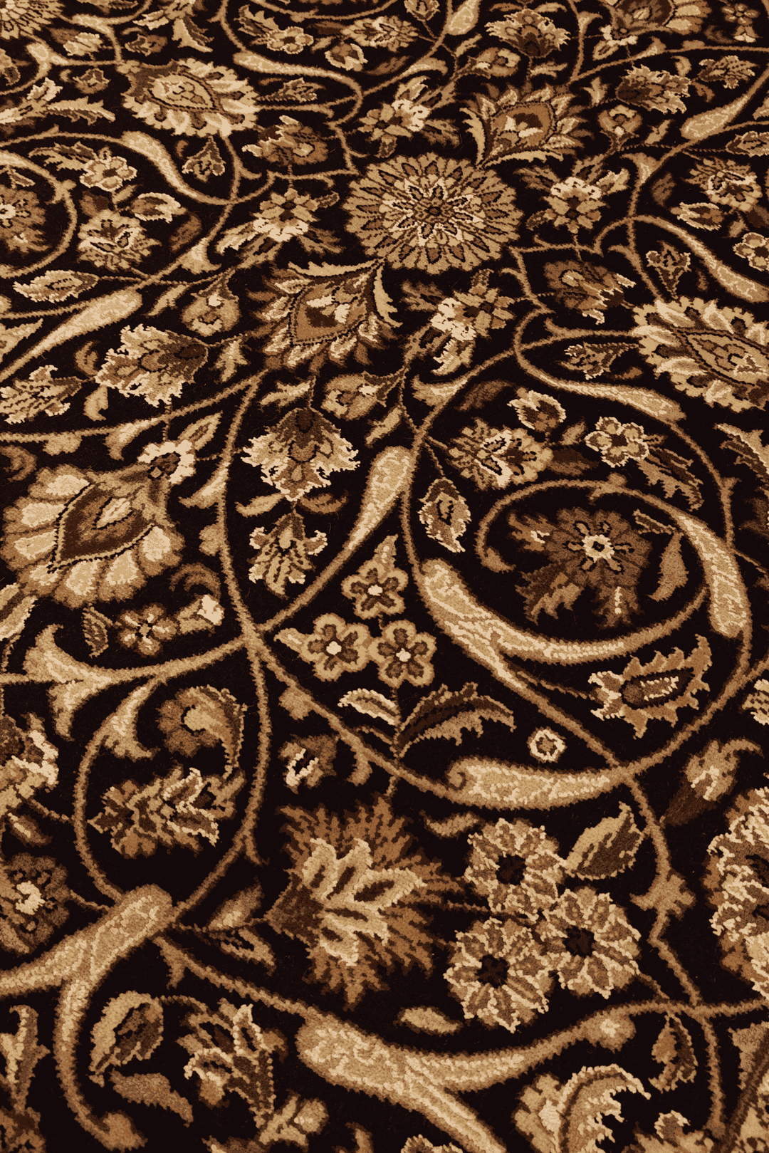 All-over floral detail in ebony and gold on Tabriz rug