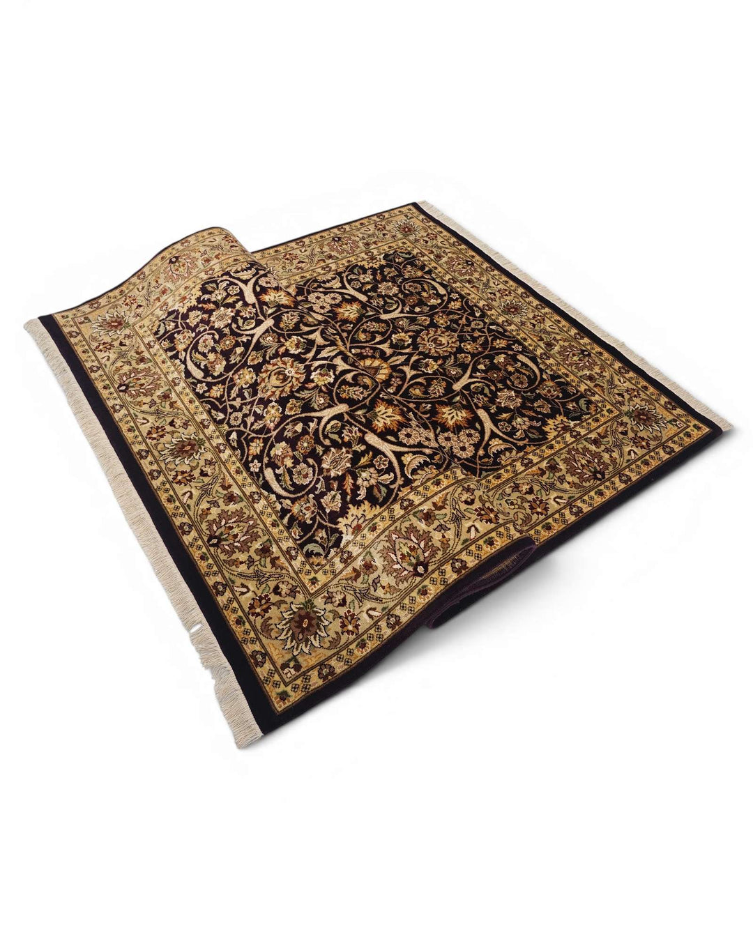 Corner of ebony gold Tabriz Pakistani double-knot rug