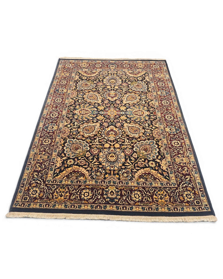 Hand-knotted jet black rug with gold Tabriz floral field