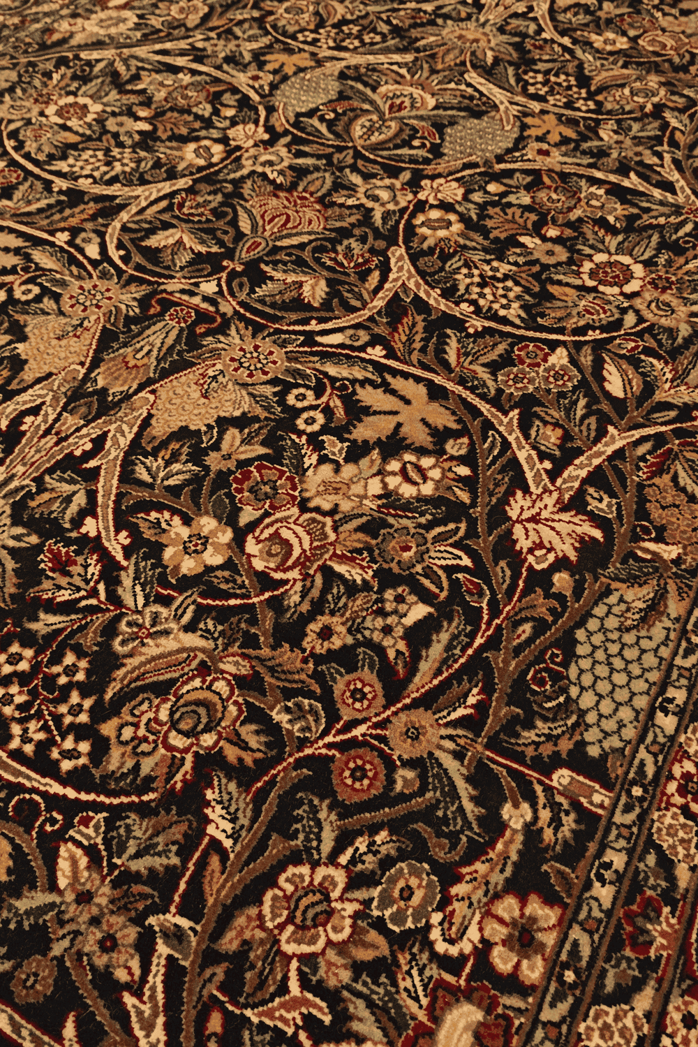Garden floral detail in black on Tabriz Pakistani rug