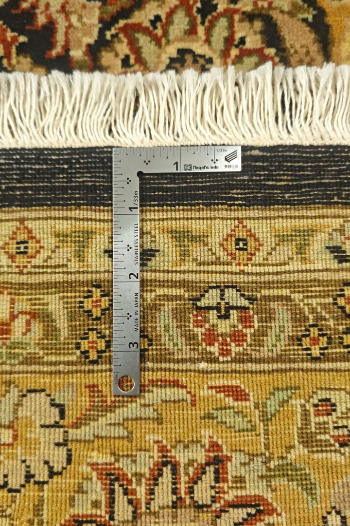 Black and gold floral vine rug, hand-knotted Pakistani wool