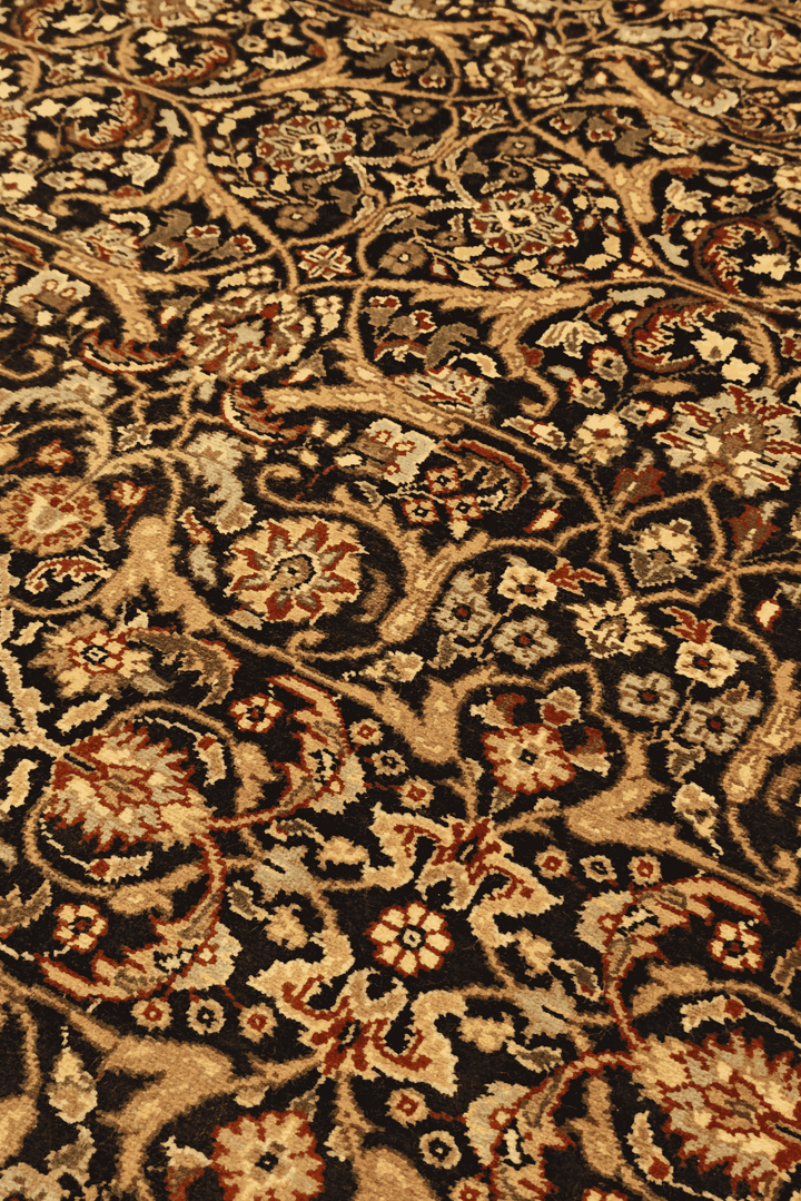 All-over floral detail in onyx and gold on Tabriz rug