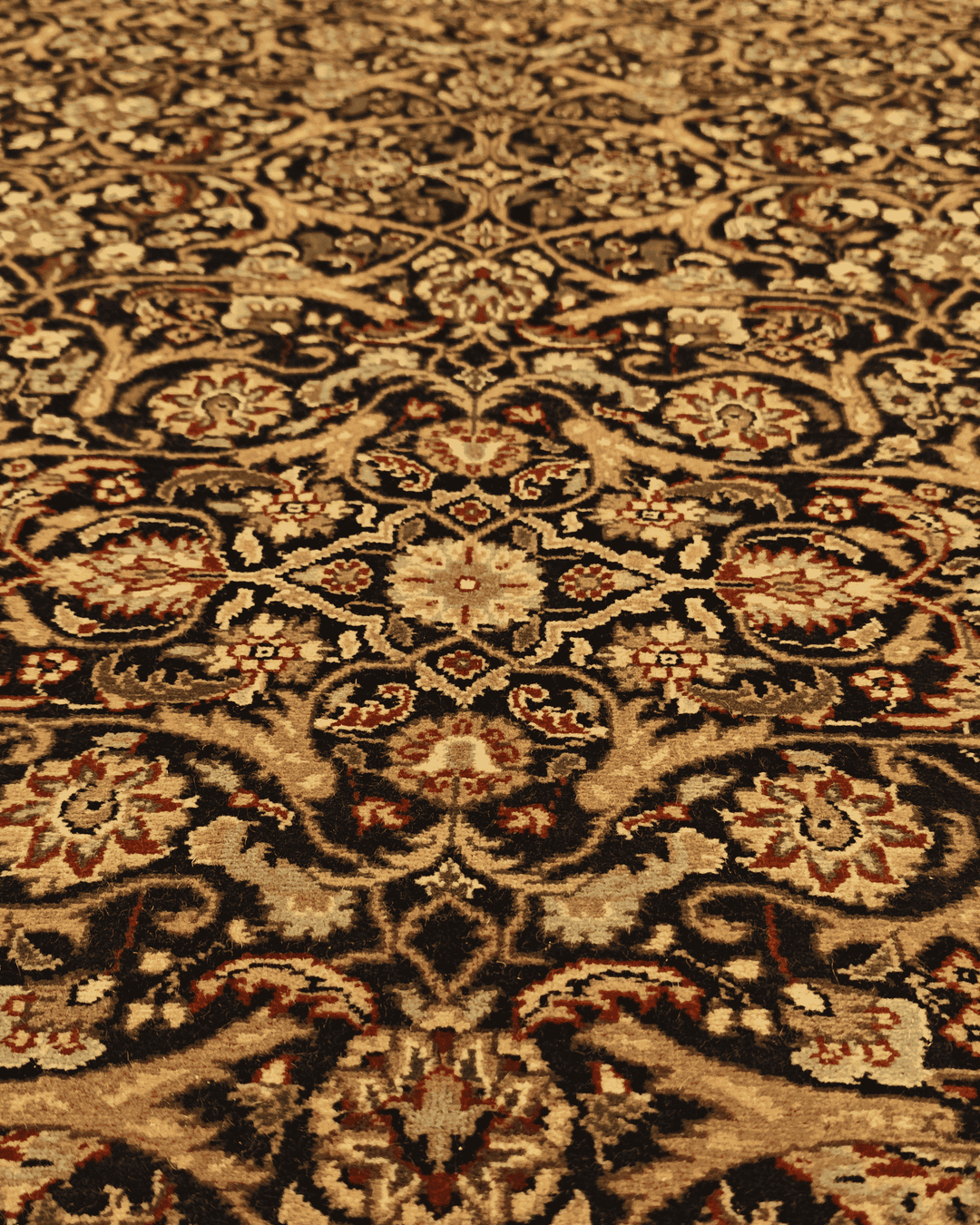 Fringe of onyx and gold floral hand-knotted rug