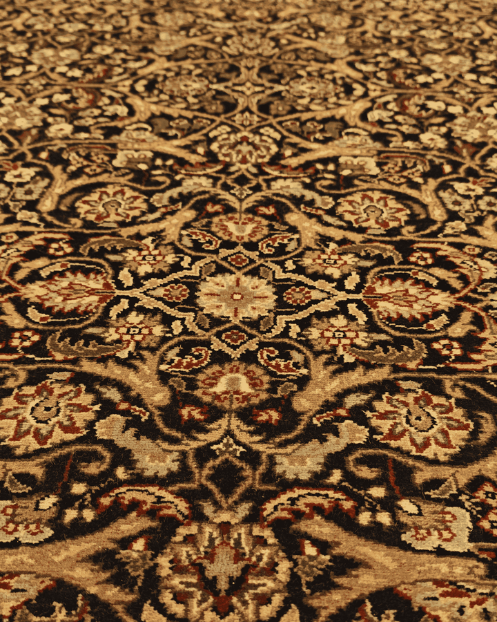 Fringe of onyx and gold floral hand-knotted rug