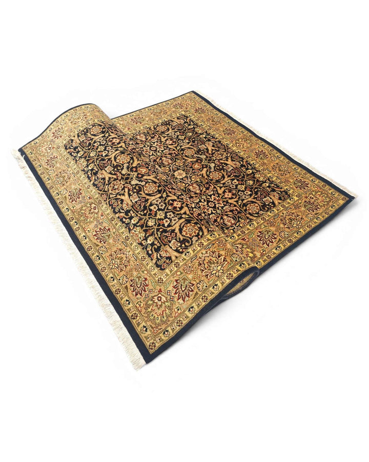 Corner of onyx gold Tabriz Pakistani double-knot rug
