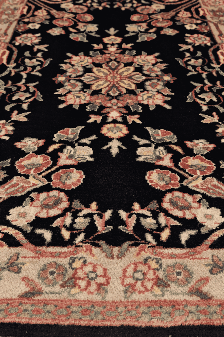 Hand-knotted black rug with cream Kashan floral medallion