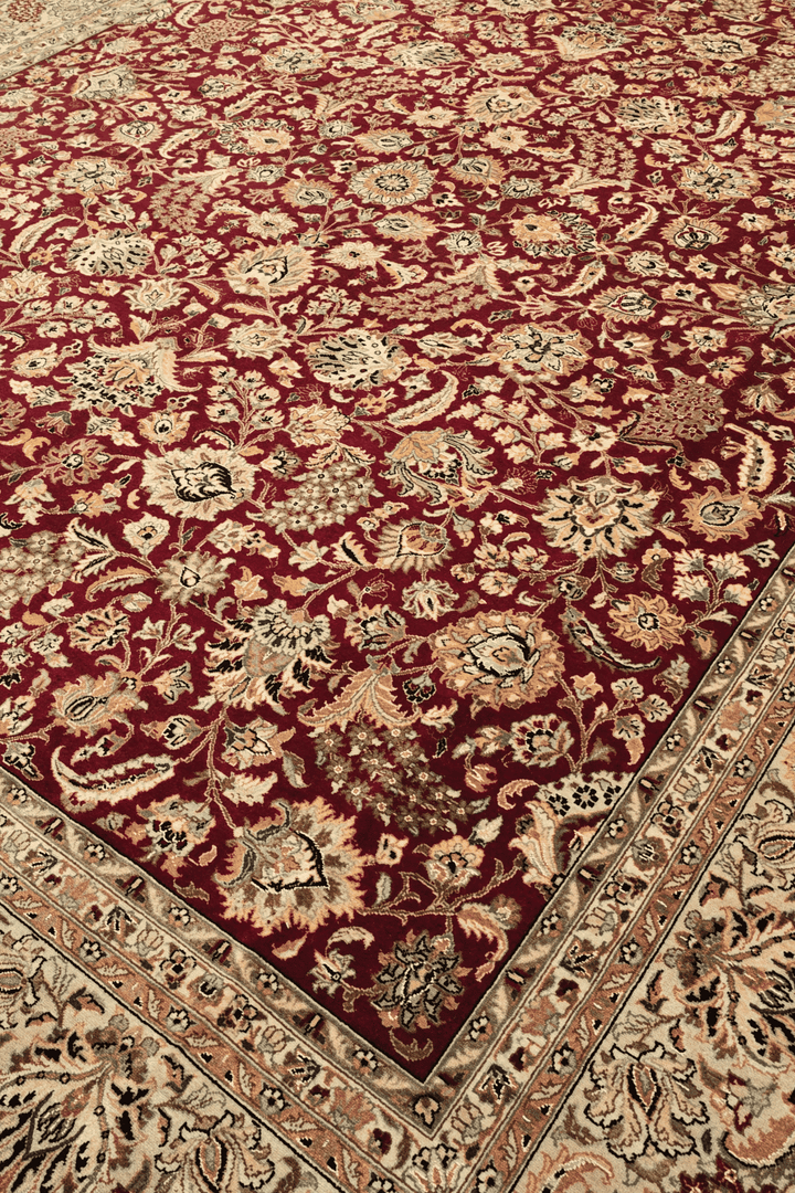 Shah Abbasi floral detail in burgundy and camel on Pakistani rug
