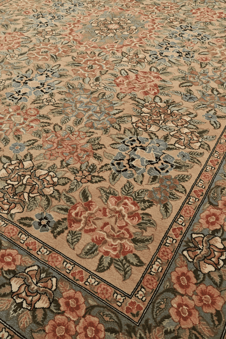 Gol Farang rose detail in camel and pink on Pakistani rug