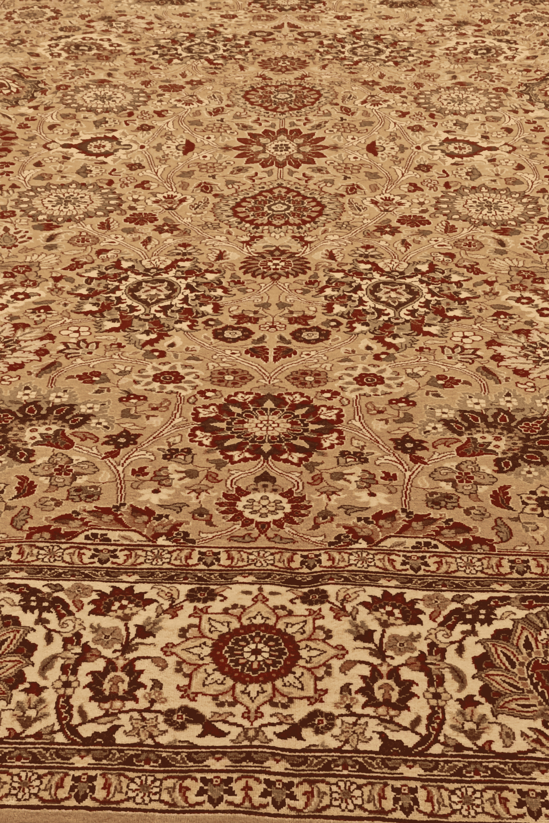 Fringe of gold and ivory Tabriz hand-knotted rug