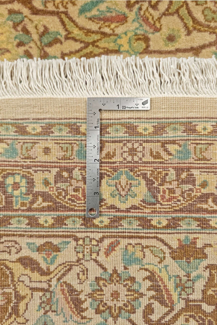 Corner of cream brown lattice Pakistani double-knot rug