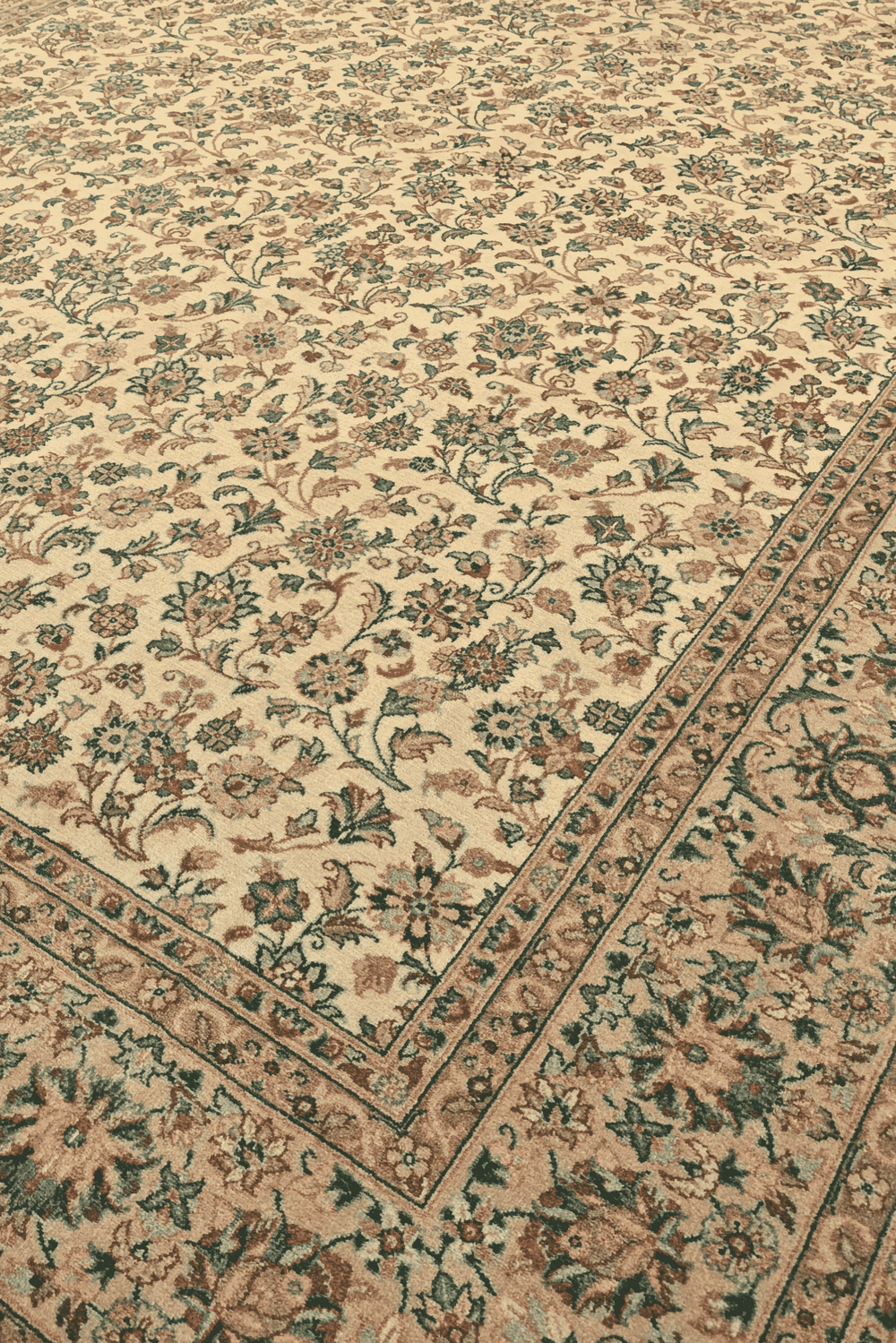 Afshan floral vine detail in cream and green on Pakistani rug