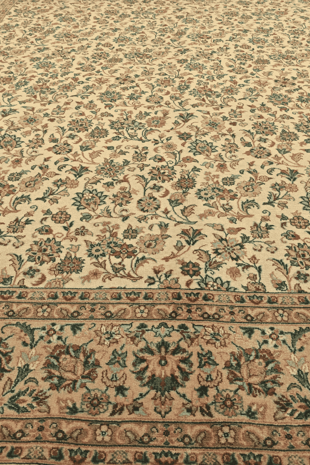 Fringe of cream and green floral vine hand-knotted rug