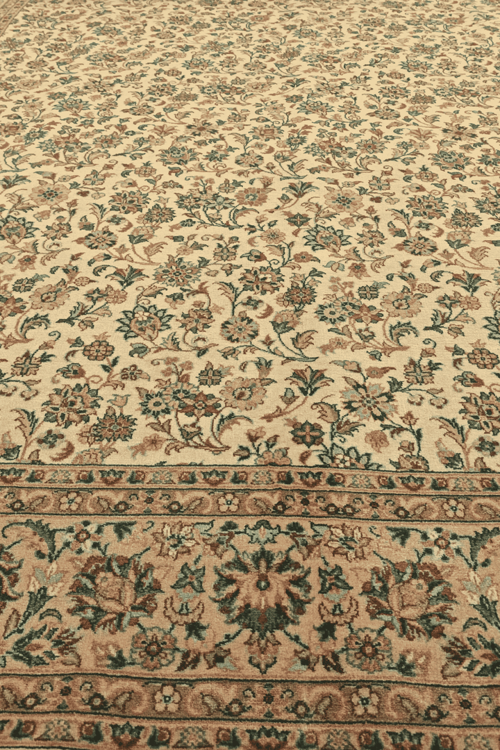 Fringe of cream and green floral vine hand-knotted rug