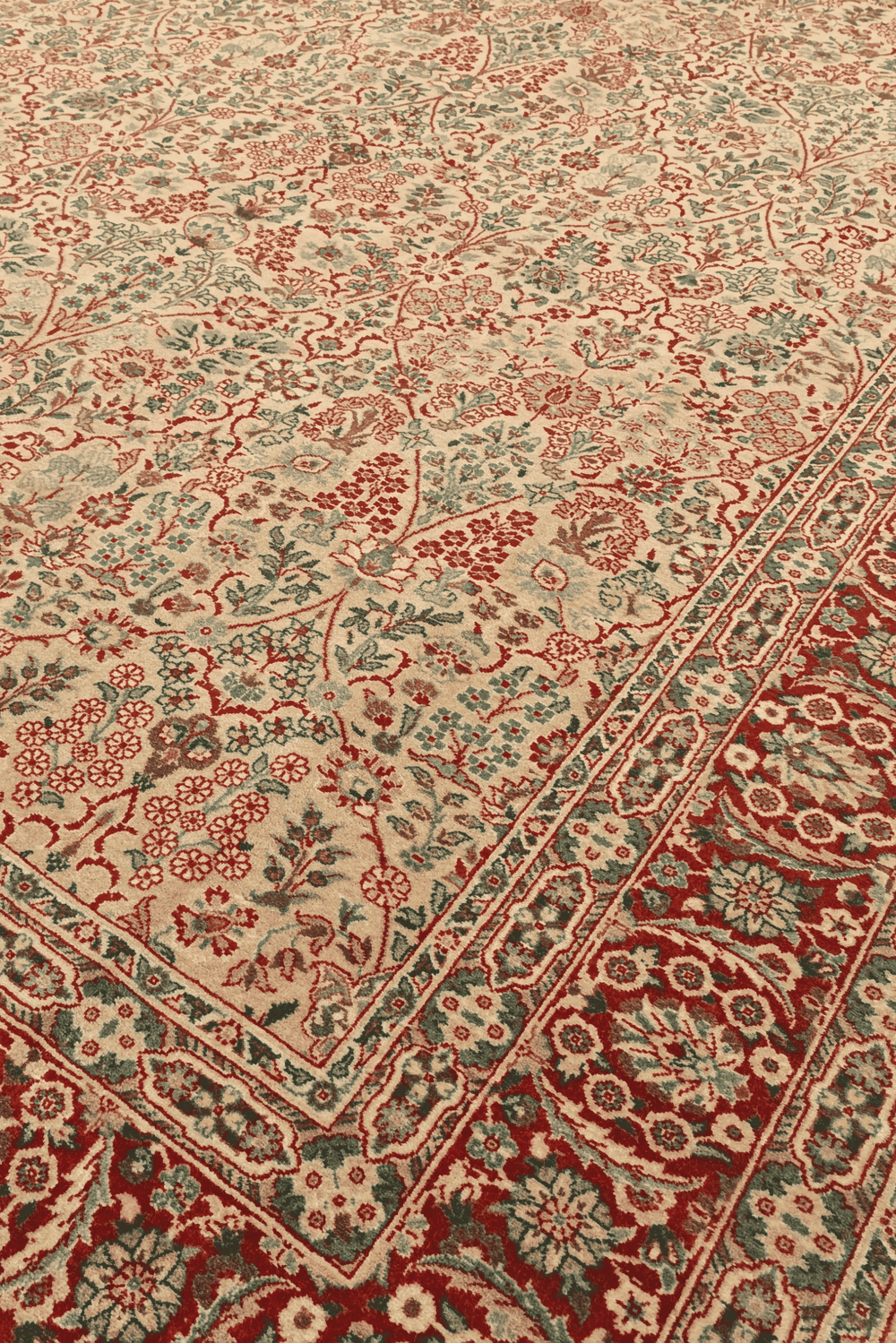 Tabriz floral detail in cream and red on Pakistani rug
