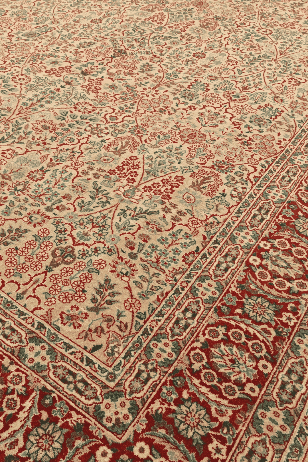 Tabriz floral detail in cream and red on Pakistani rug
