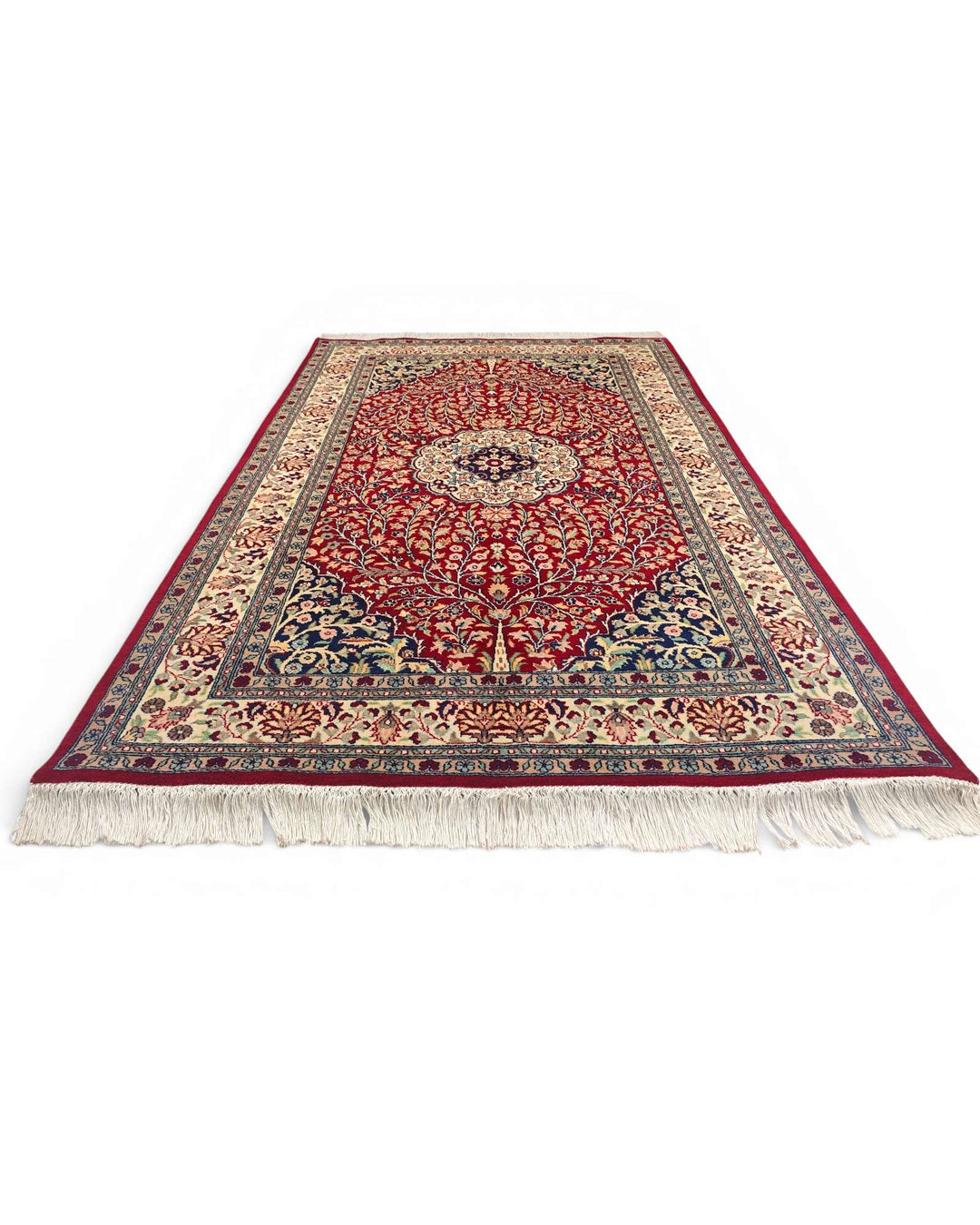 Corner of crimson Tabriz Pakistani double-knot rug