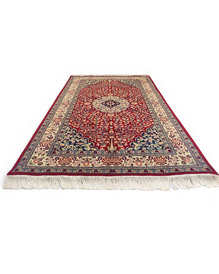 Corner of crimson Tabriz Pakistani double-knot rug